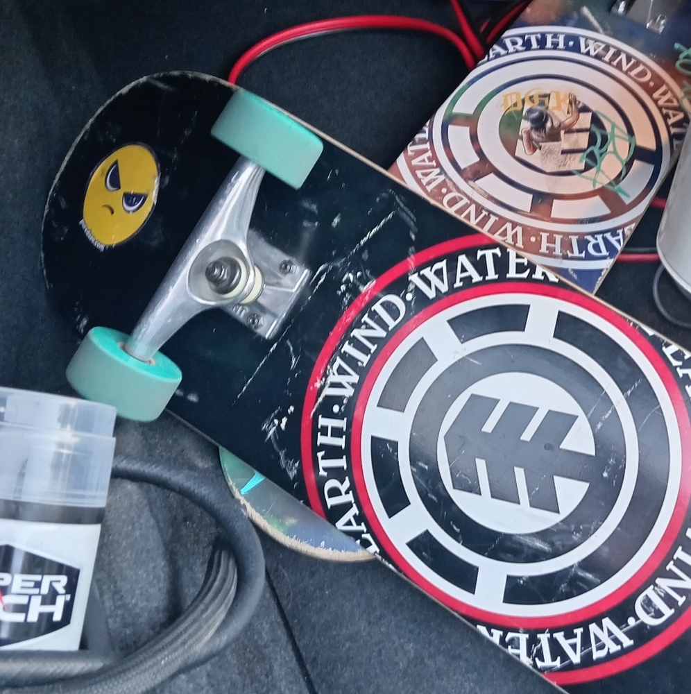 Element Skateboard with Black and Teal Wheels